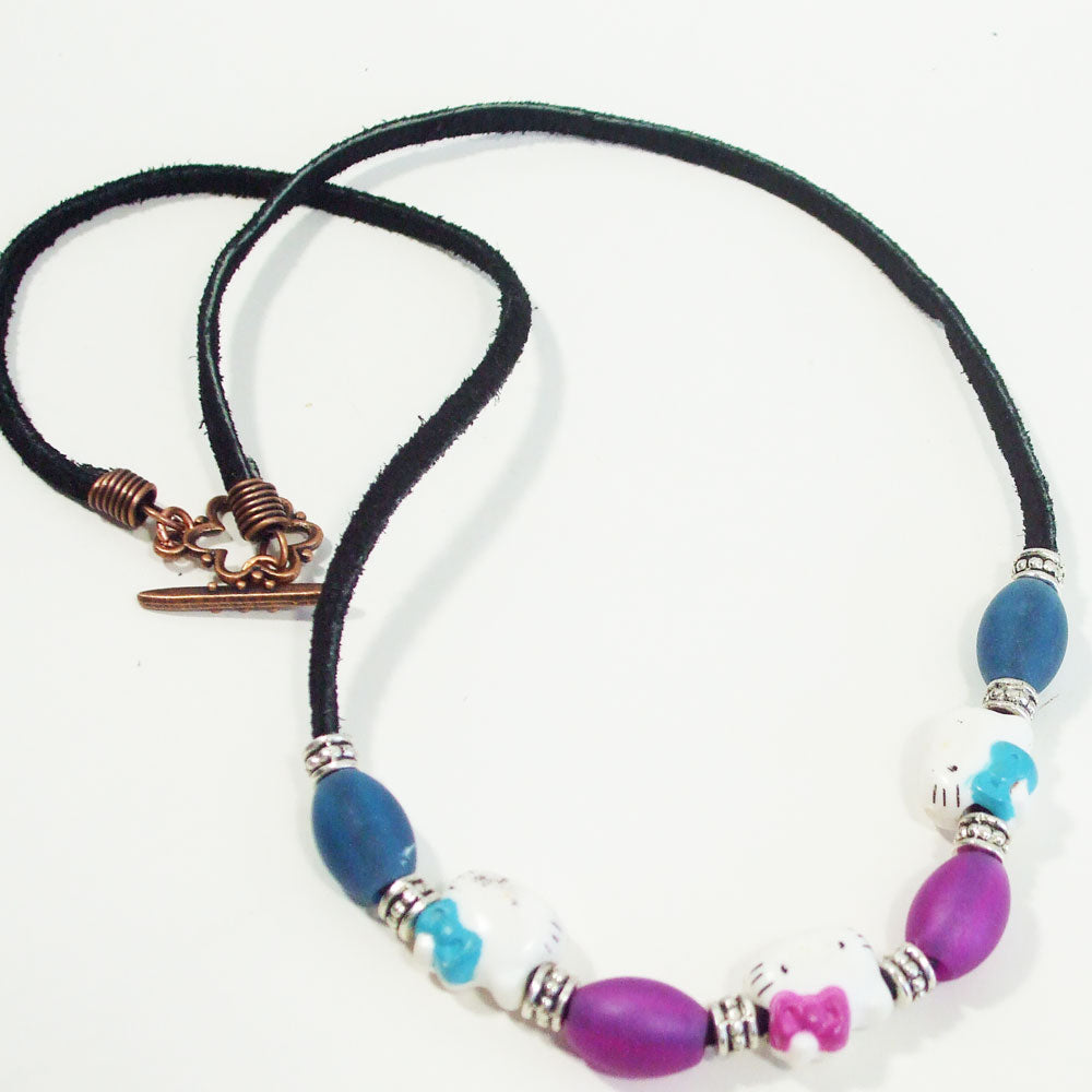 7550 *Kittens with bows, colored glass and silver accent beads. *Black Leather cord with copper toggle clasp.