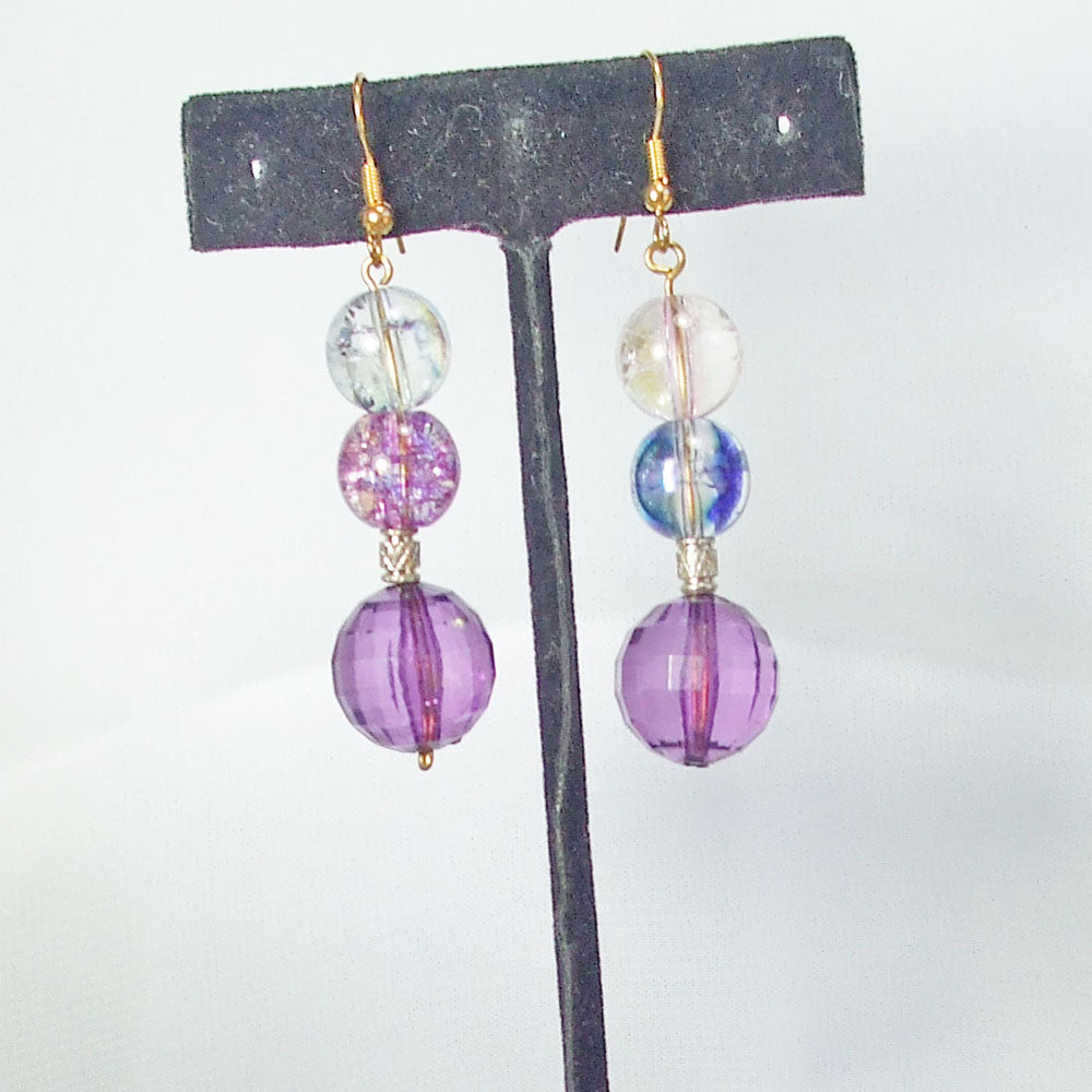 1303  *3 large glass beads in clear, blue, purple color on wire dangle.