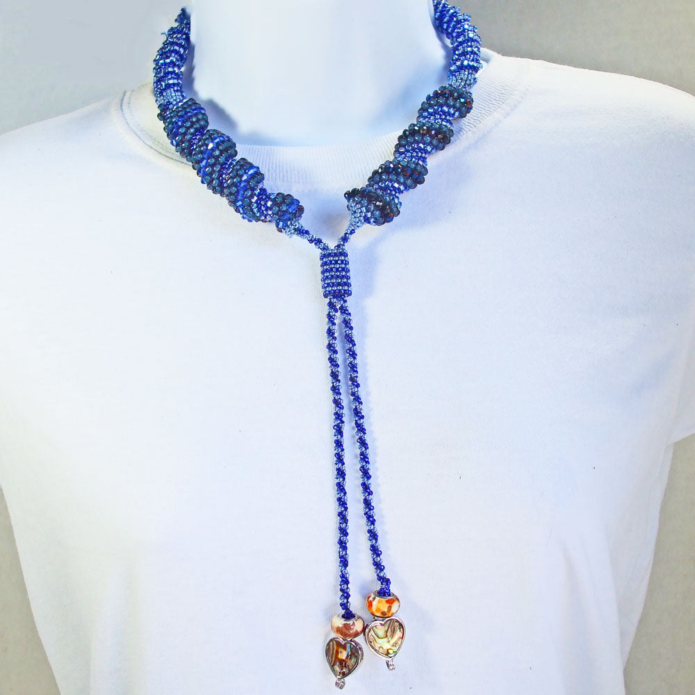 *HandCrafted.  Cellini meaning twisted swirls of beads in different sizes.  Three shades of blue beads in seed beads and Crystals mixed into one neckwear.