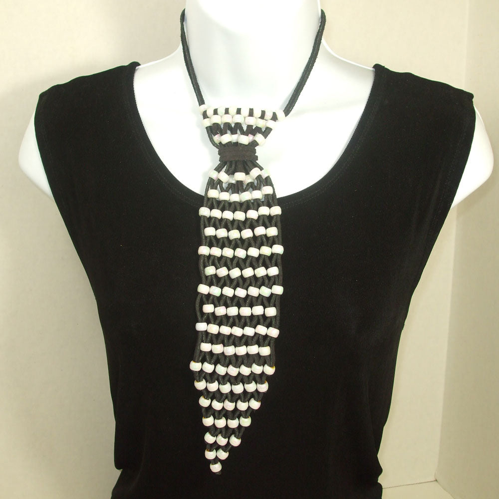 *Handcrafted, beaded leather women’s necktie jewelry.
*Black leather strips with iridescent pony beads crafted into necktie.