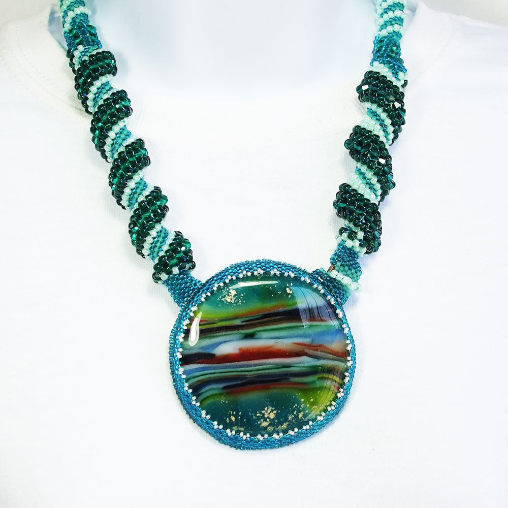 7495-Melted glass multi colored cabochon, seed bead peyote bezel, Cellini stitch neckwear.