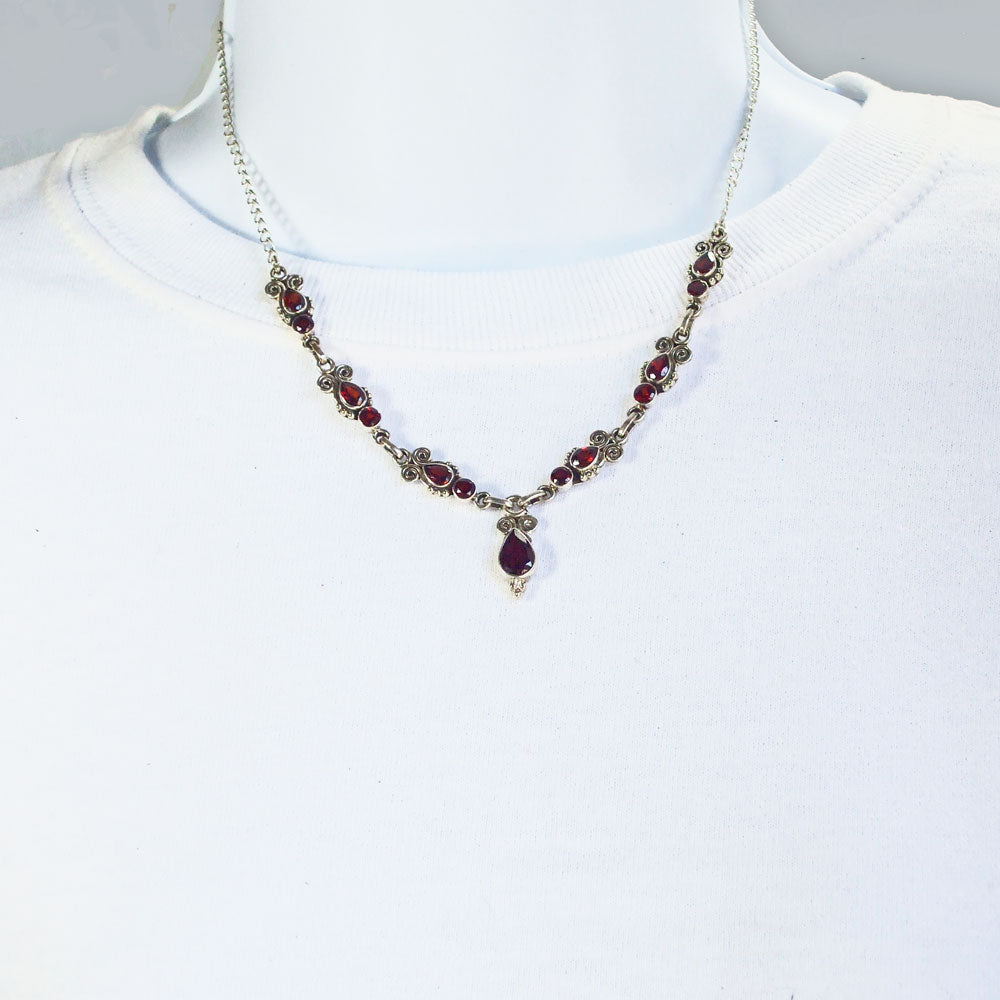 *Beautiful light garnet stone set in Sterling Silver paisley design necklace.