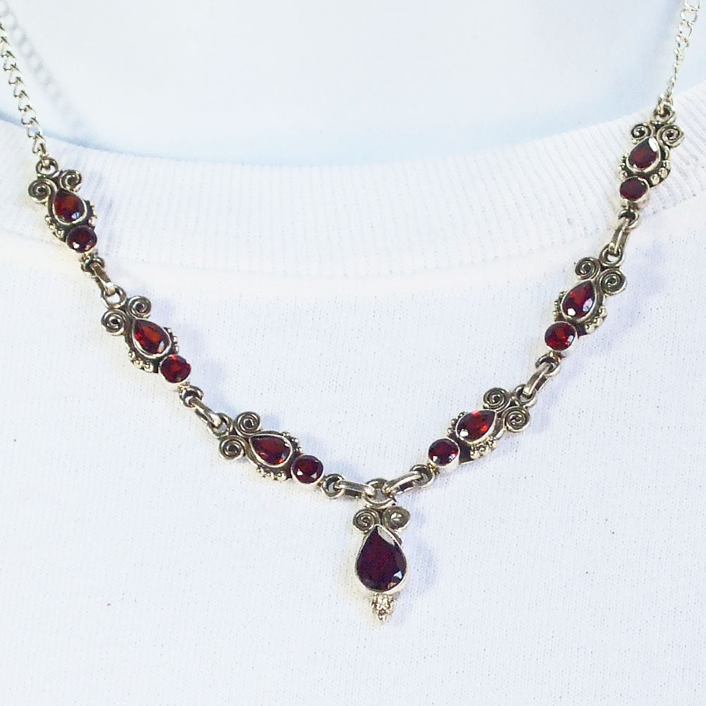 *Beautiful light garnet stone set in Sterling Silver paisley design necklace.
