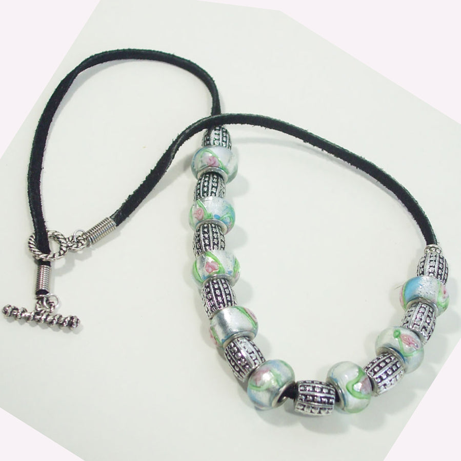 7534 *Single Black Leather cord with Painted glass and silver beads. *Size: 20 inch around the neck.  Silver toggle clasp.