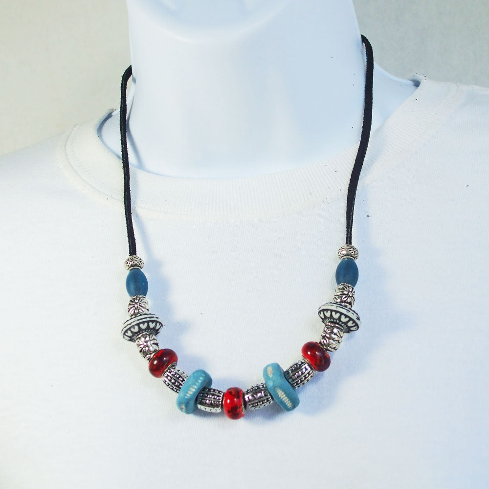 7540 *Custom made large beads in ceramics with red and blue glass beads. *Black leather cord and silver accent beads.  Silver toggle clasp.