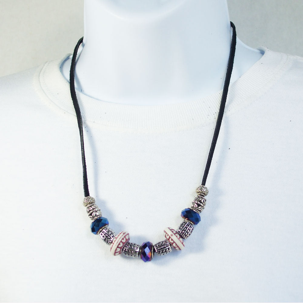 7544 *Blue designer bead with blue glass, silver and red ceramic beads. *Black leather single strand leather.  Silver toggle clasp.