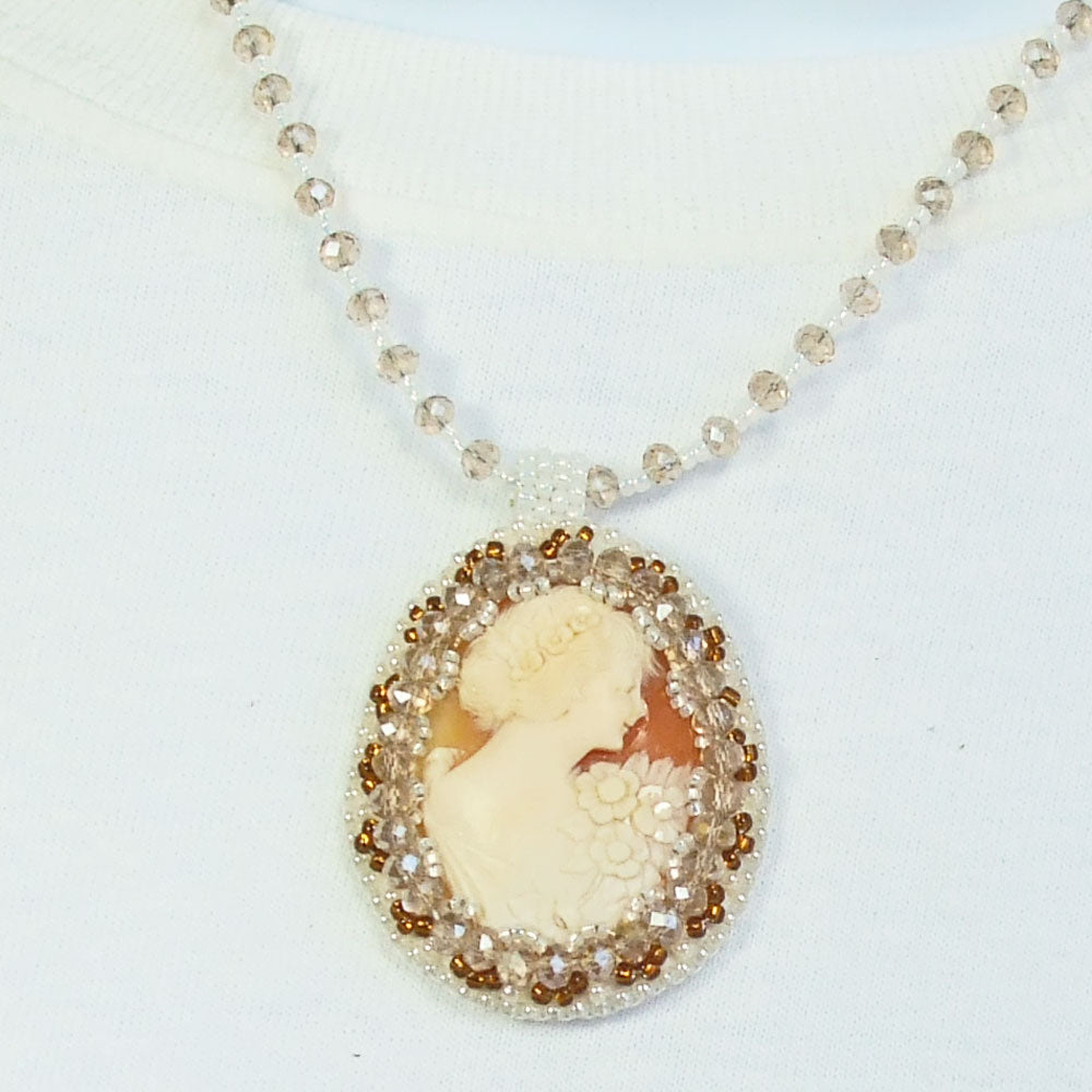 8115 40x30M size cameo in cream with tan background.